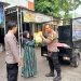 Bhabinkamtibmas Polsek Buduran Distribusikan Beras Murah Gunakan Motor Roda Tiga