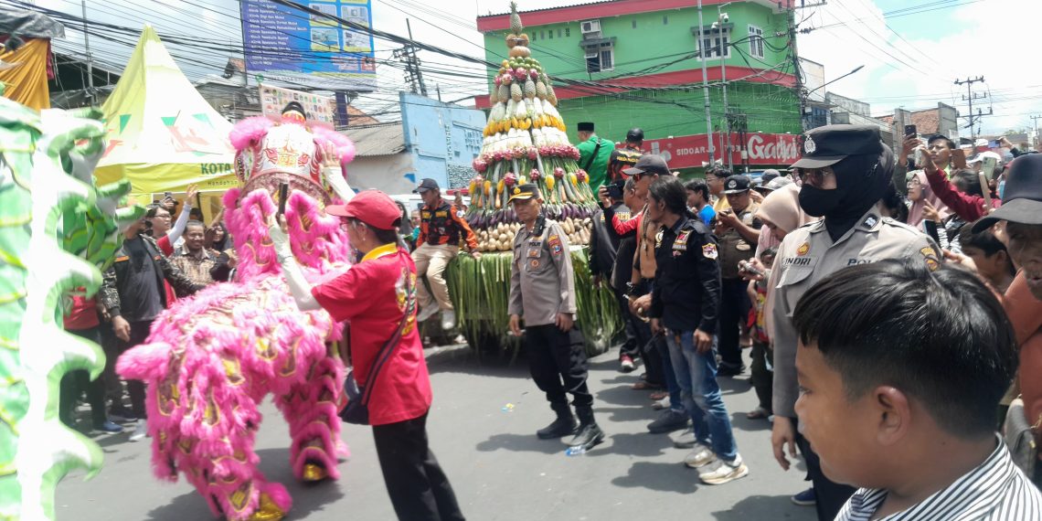 Polsek Krian Amankan Kirab Budaya Sedekah Bumi Perayaan Kongco Kong Tek Cun On